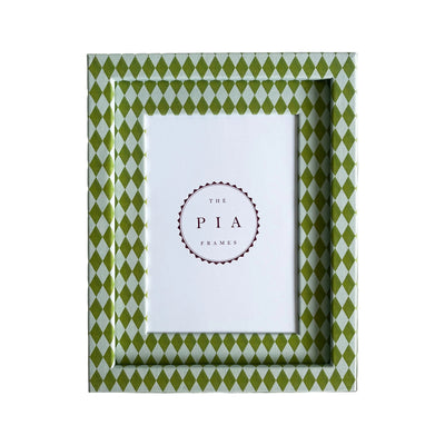Hand wrapped chartreuse and blue harlequin fabric frame, on a white linen background