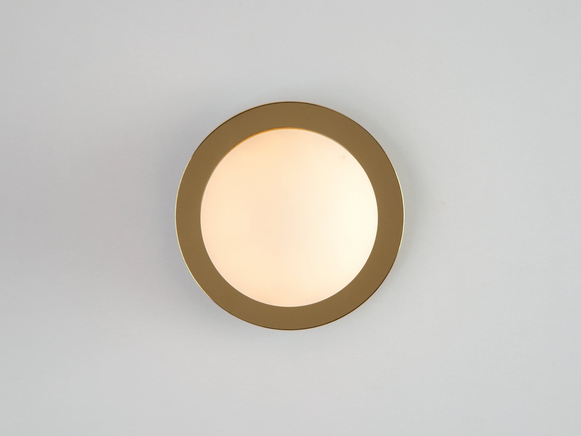 Brass opal disc wall light