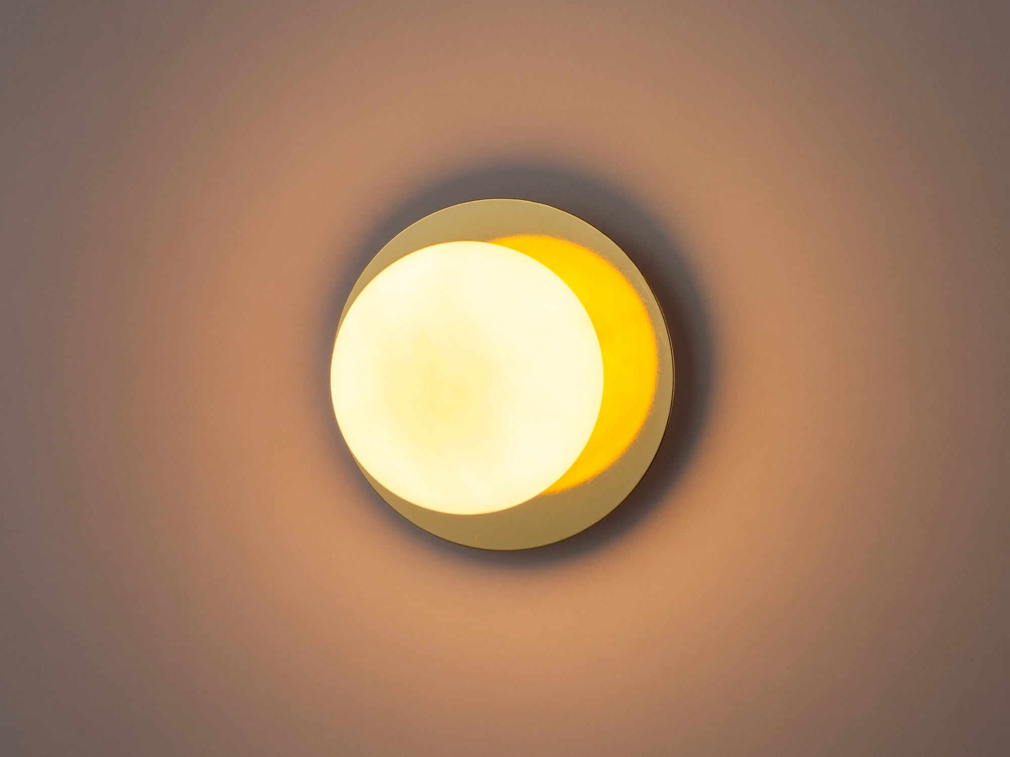 Brass opal disc wall light