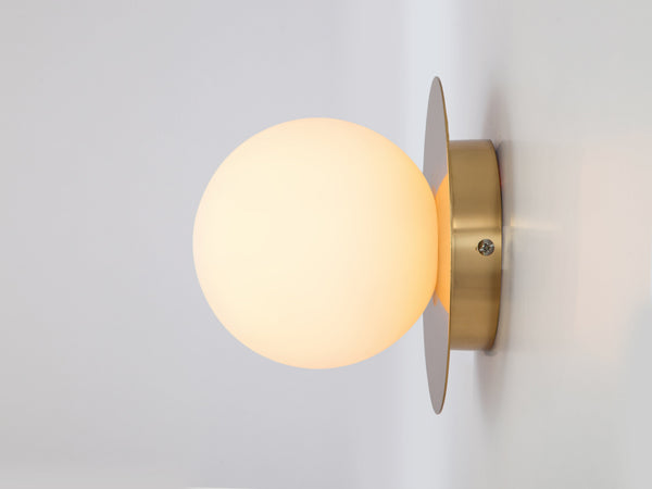 Brass opal disc wall light