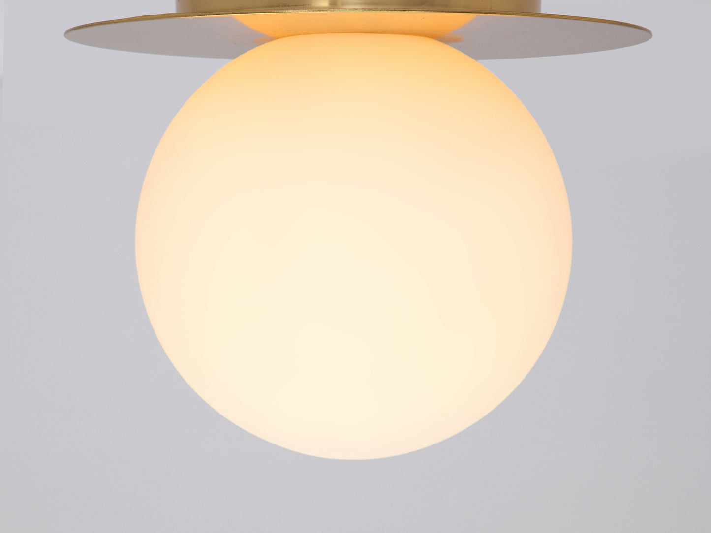 Brass opal disc wall light