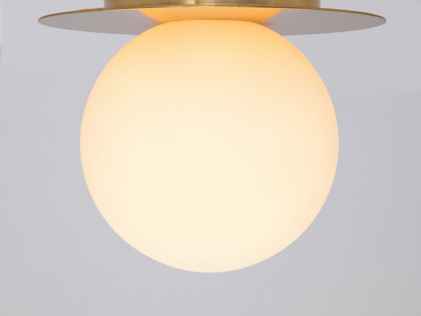 Brass opal disc wall light