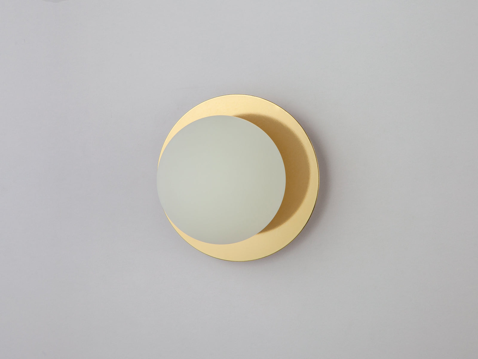 Brass opal disc wall light