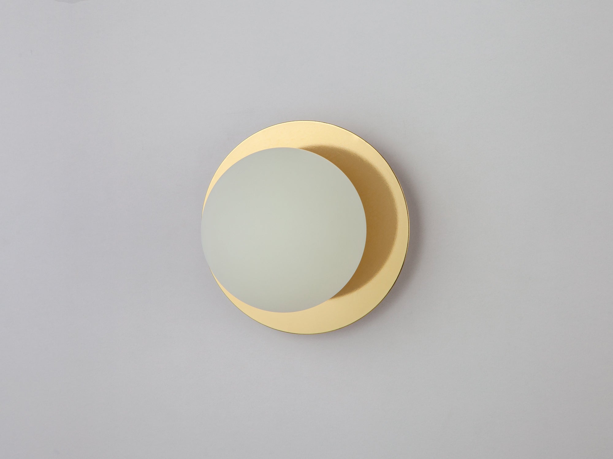 Brass opal disc wall light