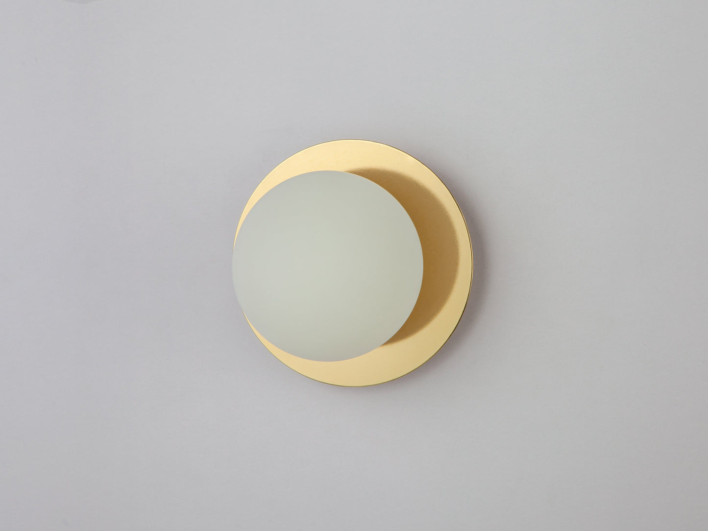 Brass opal disc wall light