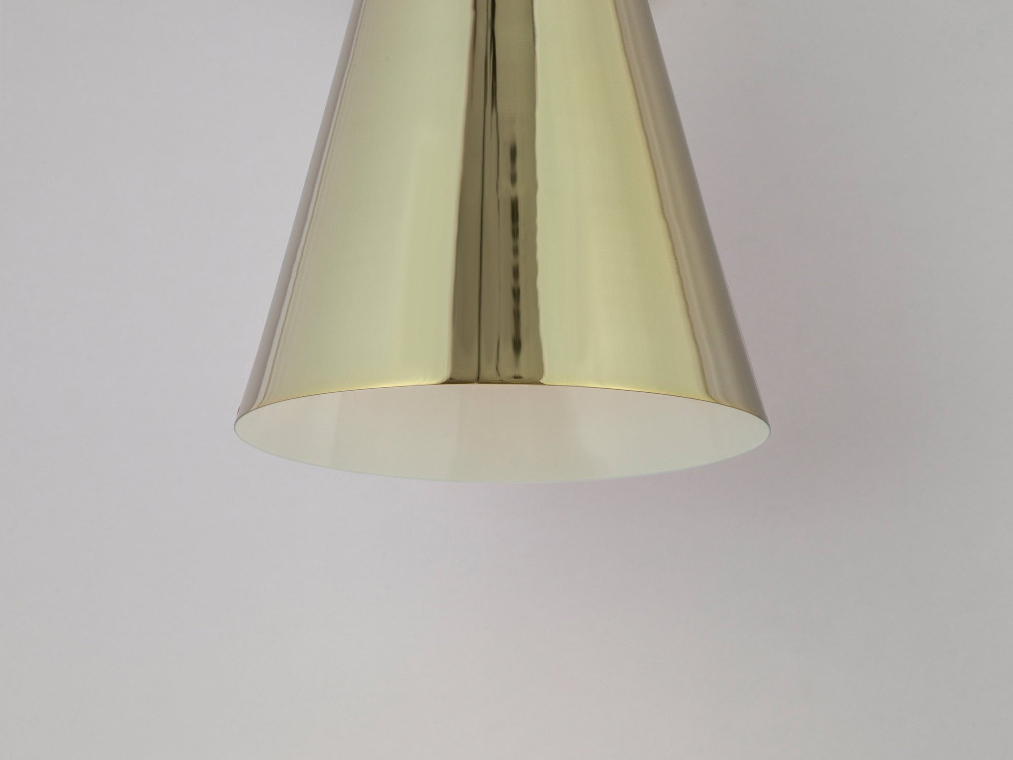 Brass cone shade wall light