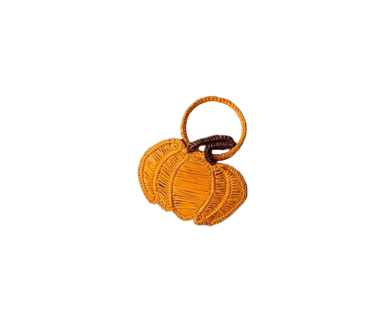 Orange pumpkin-shaped napkin ring with a brown stem