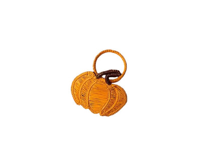 Orange pumpkin-shaped napkin ring with a brown stem