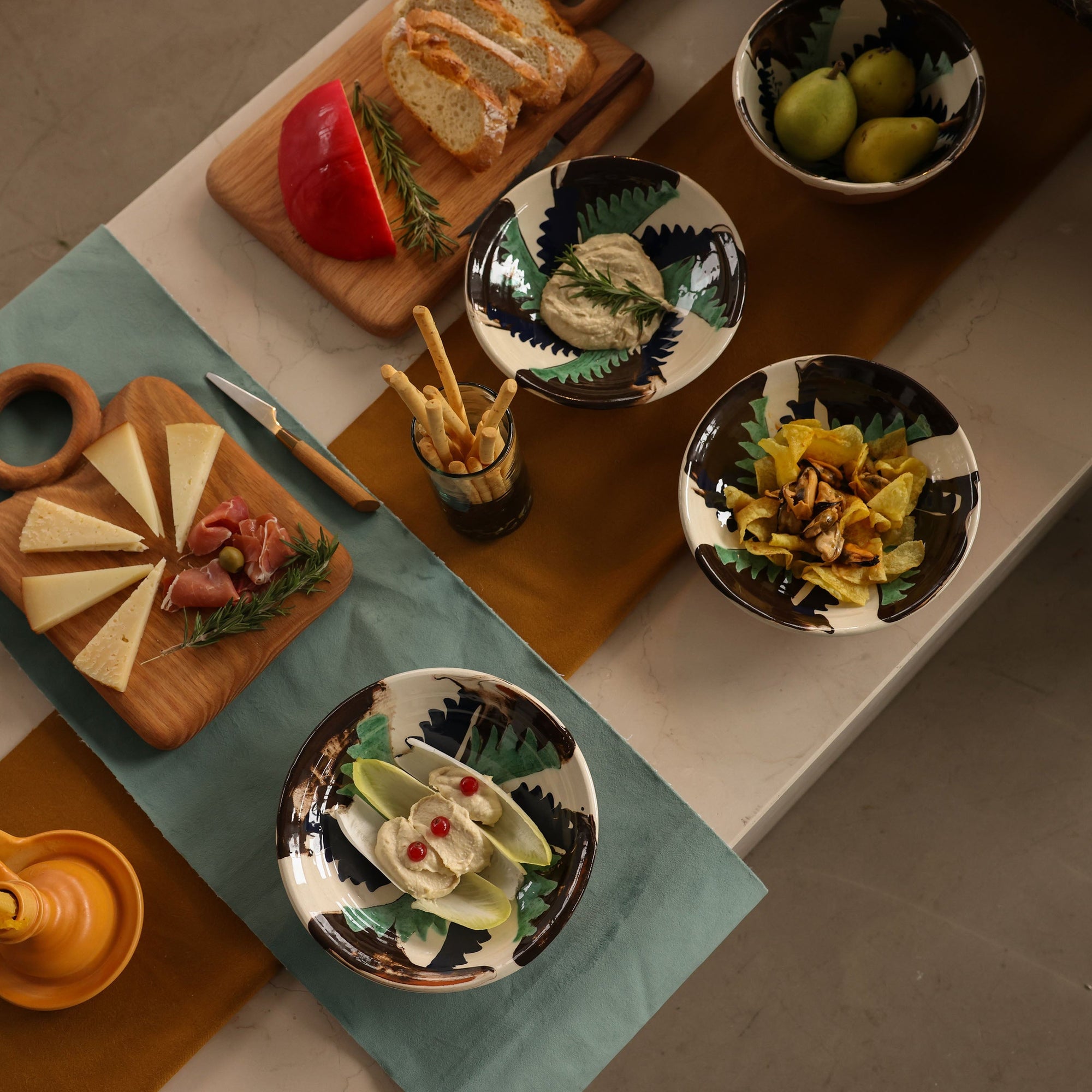 Table setting with various dishes of food on a wooden table -lifestyle