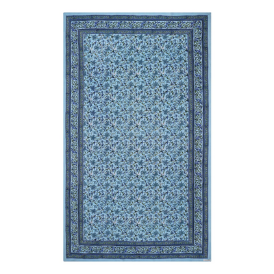 A rectangular tablecloth with a sky blue base and an intricate floral jaal pattern, displayed on a white background.
