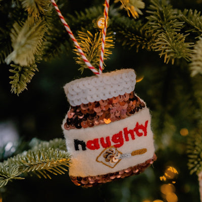 Naughty Chocolates spread jar on a christmas tree