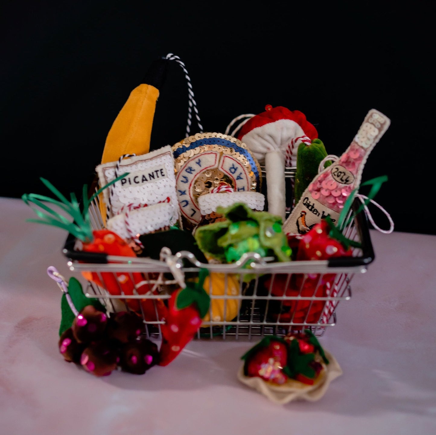 A shopping basket containing sequinned groceries