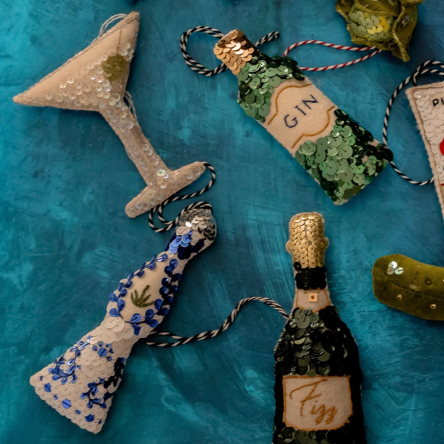 A collection of green and blue sequinned ornaments