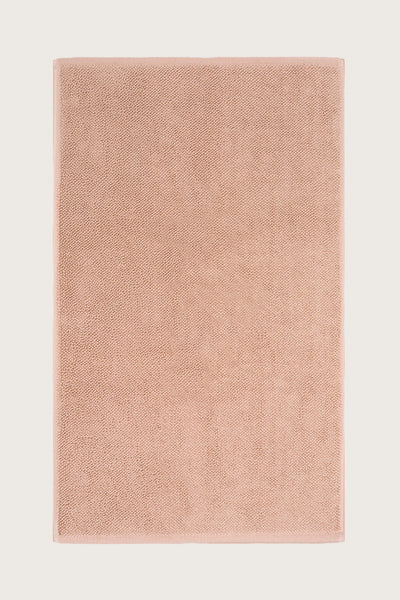 Købn Tahini  Bathmat with a plush pile cotton weave laid flat