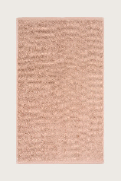Købn Tahini  Bathmat with a plush pile cotton weave laid flat