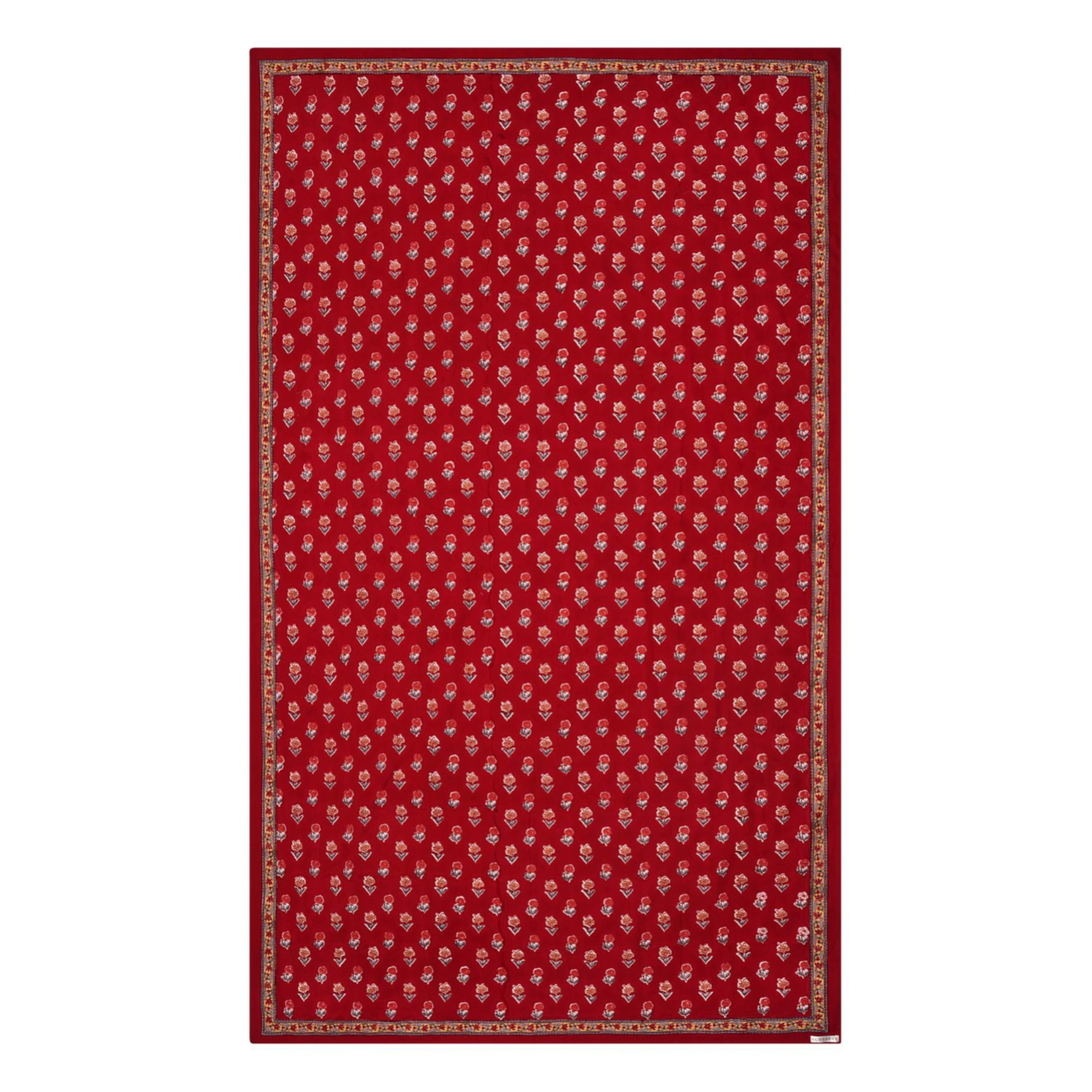 A red floral block printed tablecloth with a border