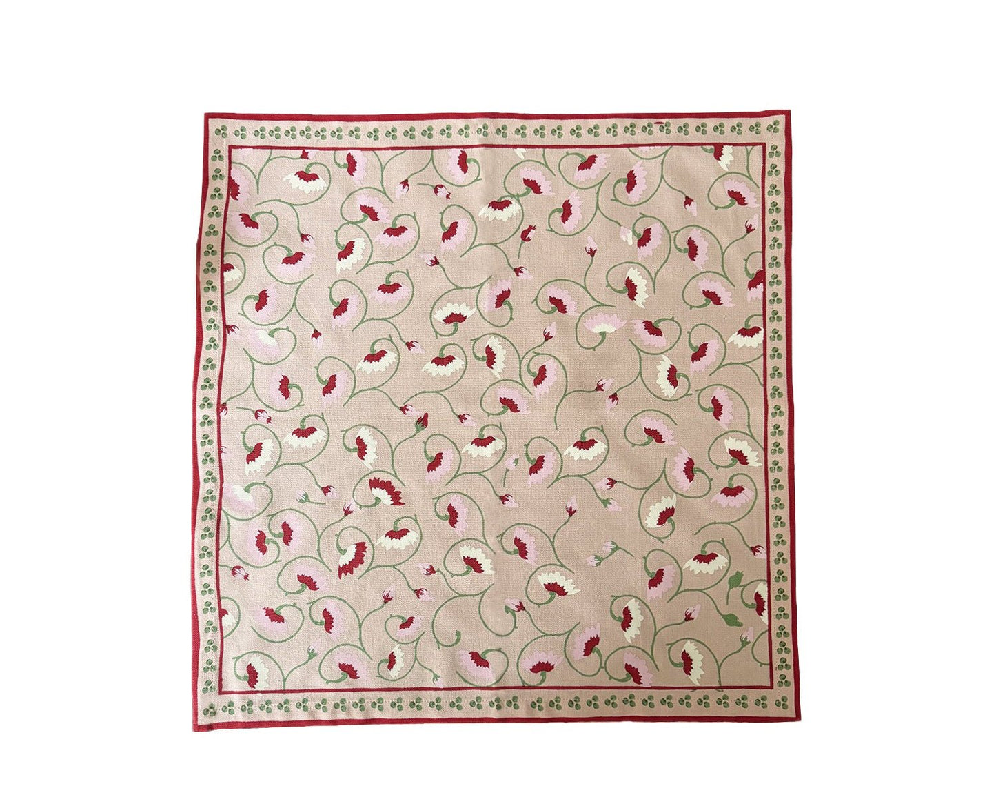 Light pink floral napkin styled on Italian-inspired table