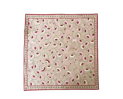 Light pink floral napkin styled on Italian-inspired table