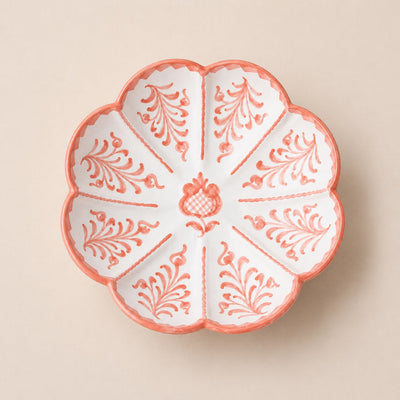 Decorative ceramic plate with floral patterns on a beige background