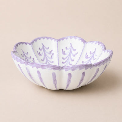 Decorative bowl with purple patterns on a beige background