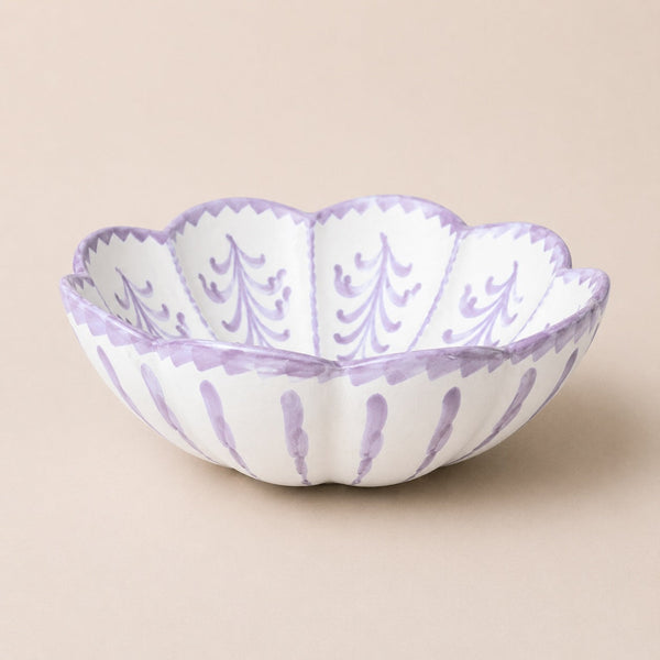 Decorative bowl with purple patterns on a beige background