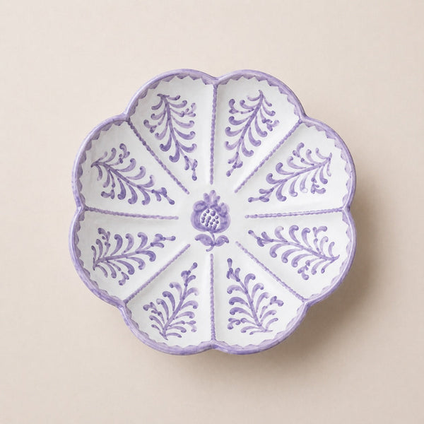 Decorative plate with purple floral patterns on a beige background