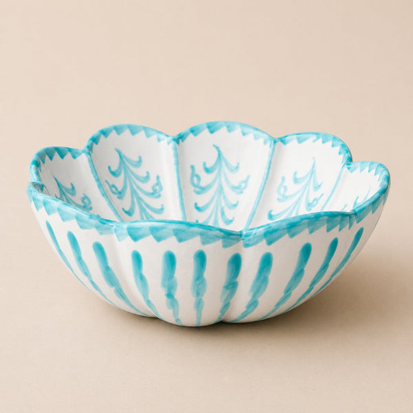 Decorative bowl with blue and white pattern on a beige background