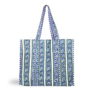 A stylish printed cotton tote bag with a striped botanical design and contrast trim in blues and greens