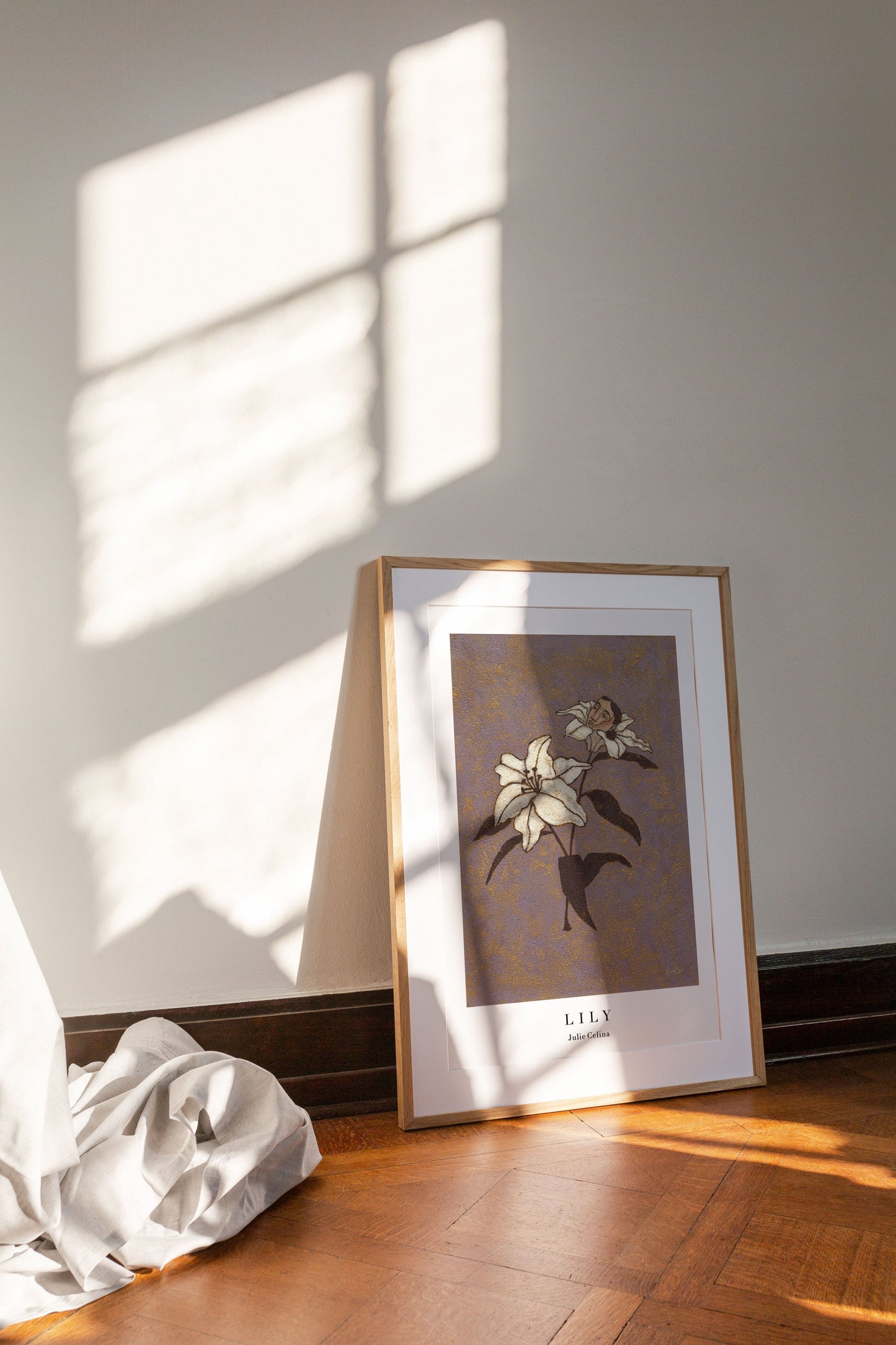 textured fine art print of a lily flower with a human head sitting inside one of the blooms on a purple background