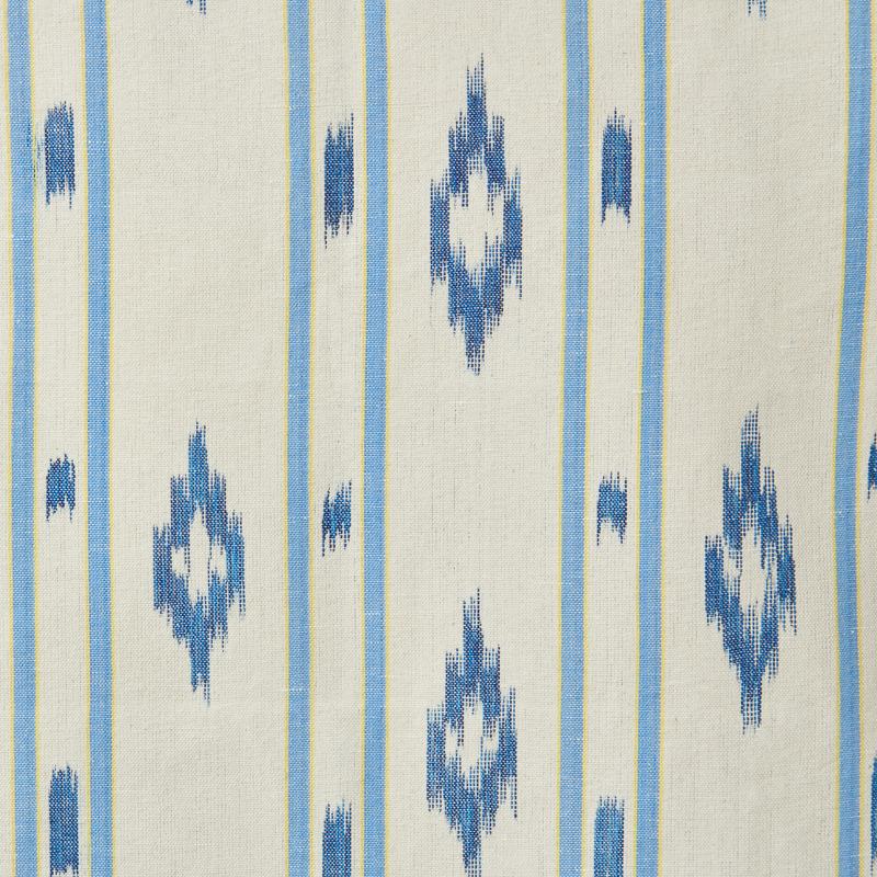 Textile pattern with blue geometric shapes on a beige background