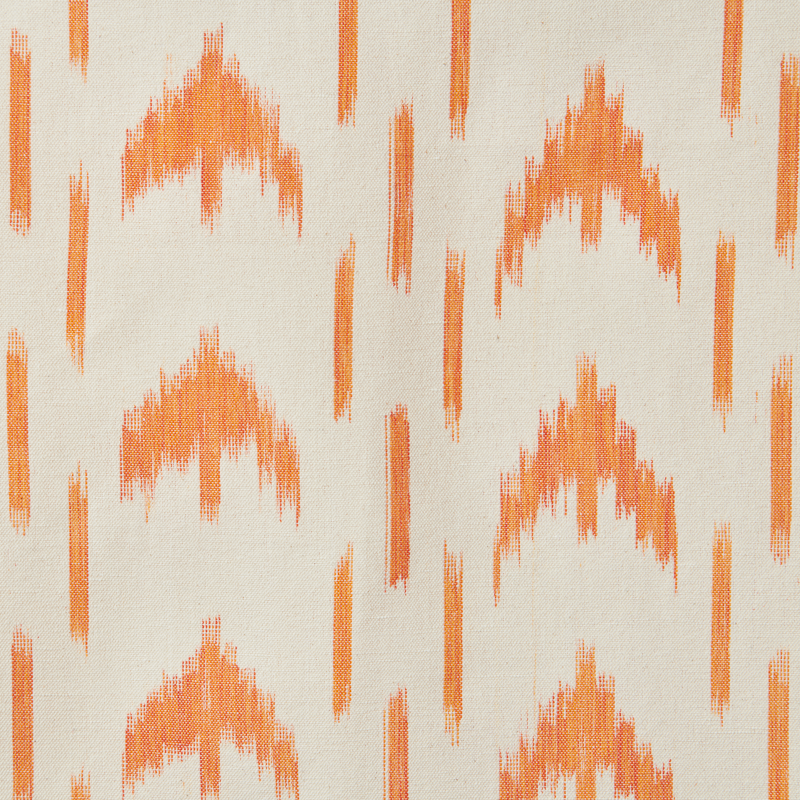 Patterned fabric with orange geometric design on a beige background