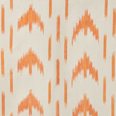 Patterned fabric with orange geometric design on a beige background