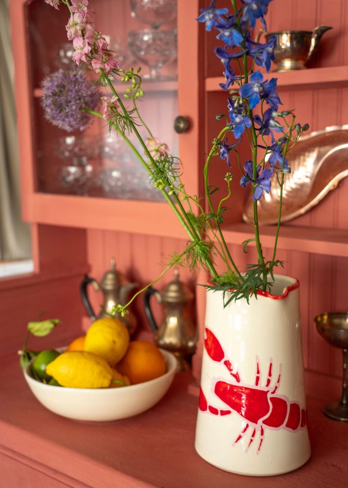 Lobster ceramic on pink cabinet with flowers