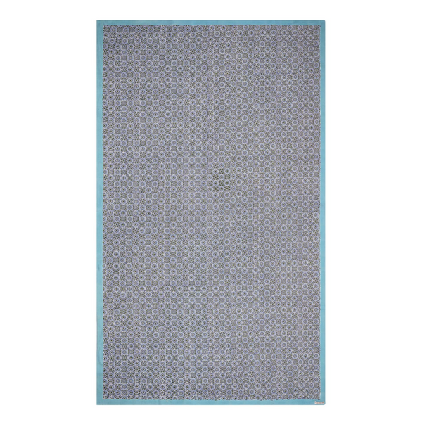 A rectangular tablecloth with a geometric pattern in shades of blue and green, with a solid white border.
