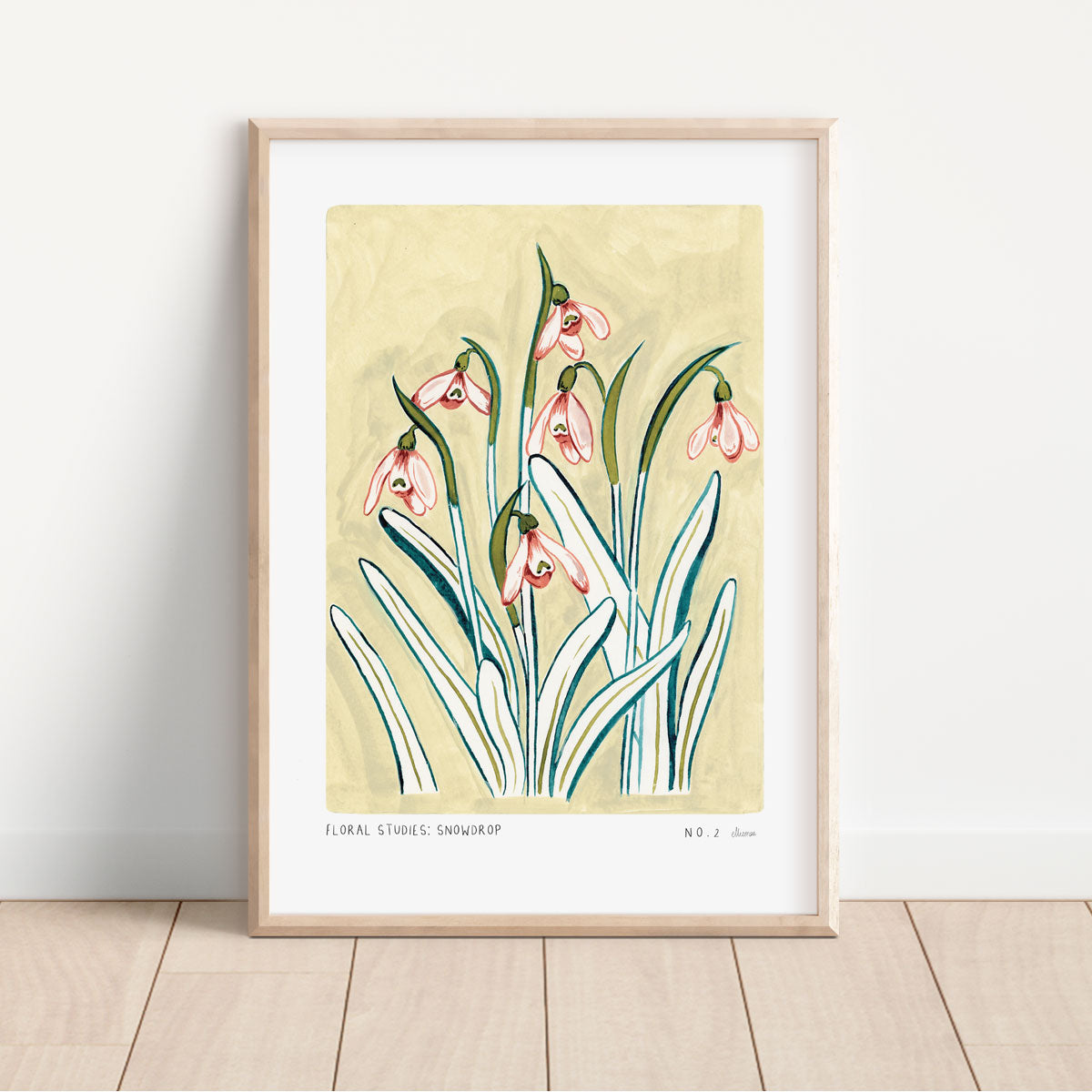 Snowdrop art print, a light muted yellow painted background with pinky snowdrop flowers and olive green/ turquoise leaves. With small text reading floral studies: snowdrop no.2