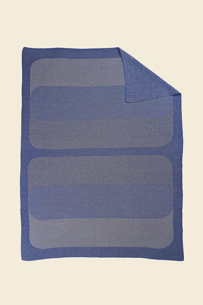 grey/blue knit blanket with flipped corner and with rectangles in merino wool and organic cotton