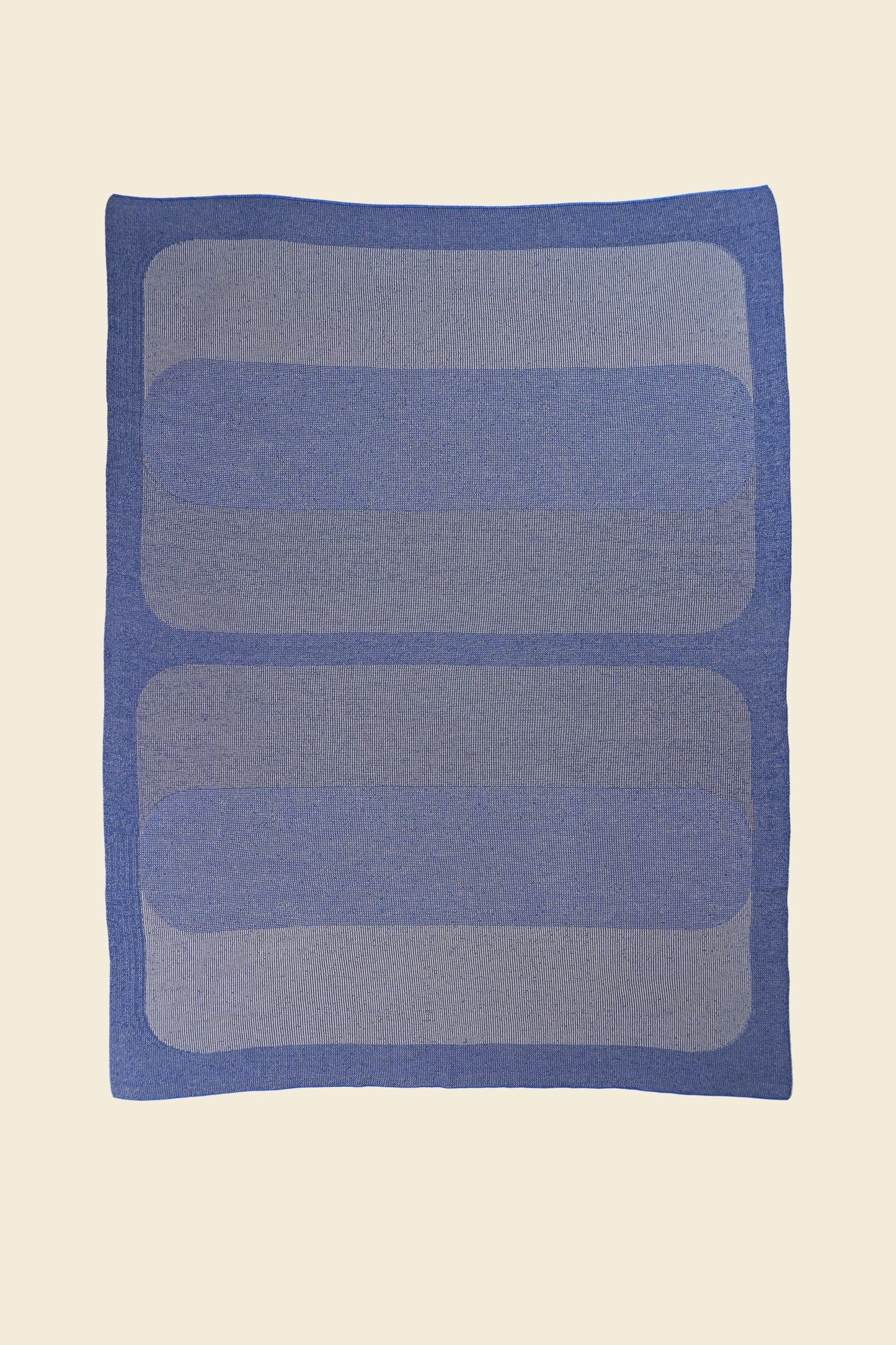 laid flat grey/blue knit blanket with rectangles in merino wool and organic cotton