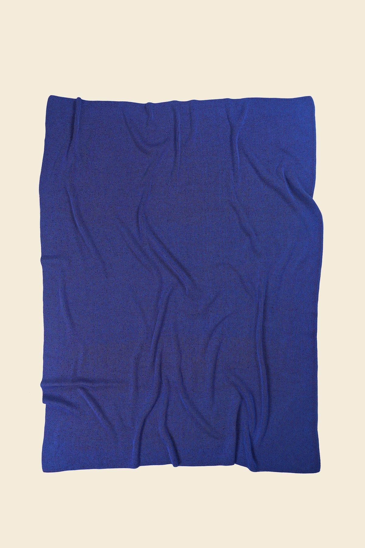 back side of purple/blue knit blanket in merino wool and organic cotton