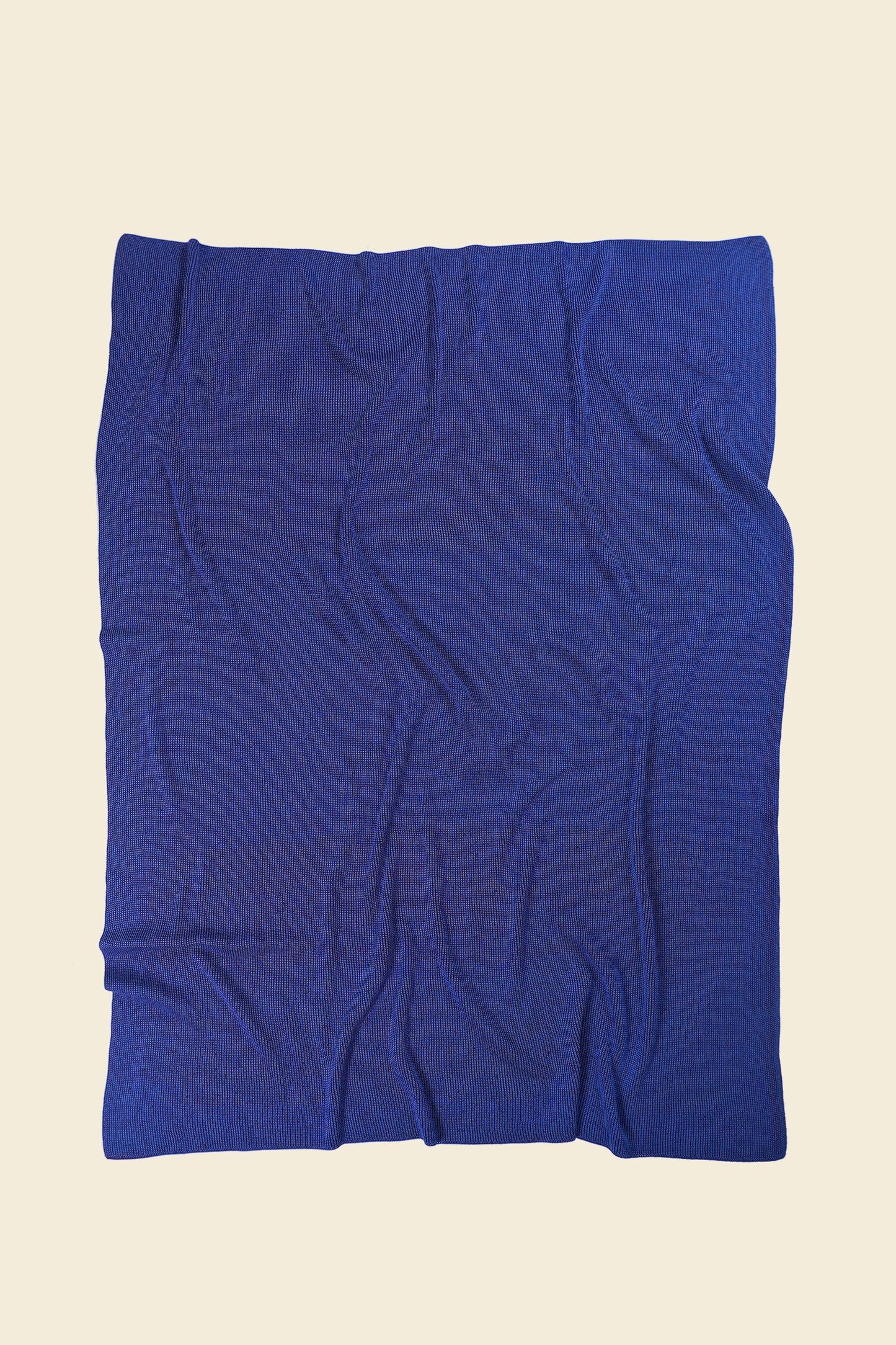 back side of purple/blue knit blanket in merino wool and organic cotton