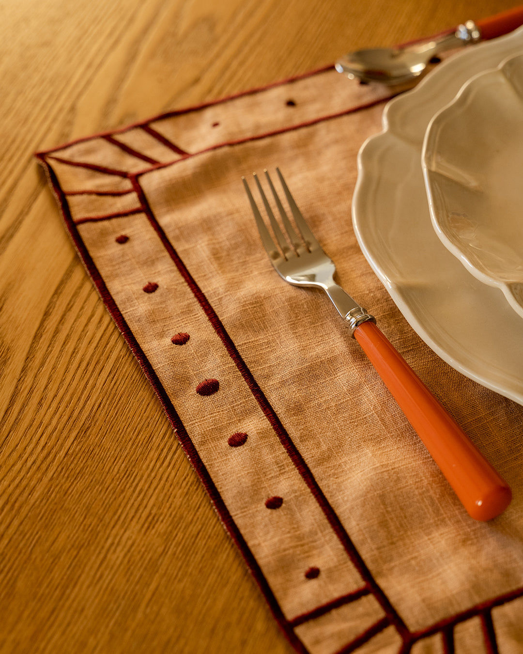 Belle Nuit Linen Placemat in Salmon and Bordeaux