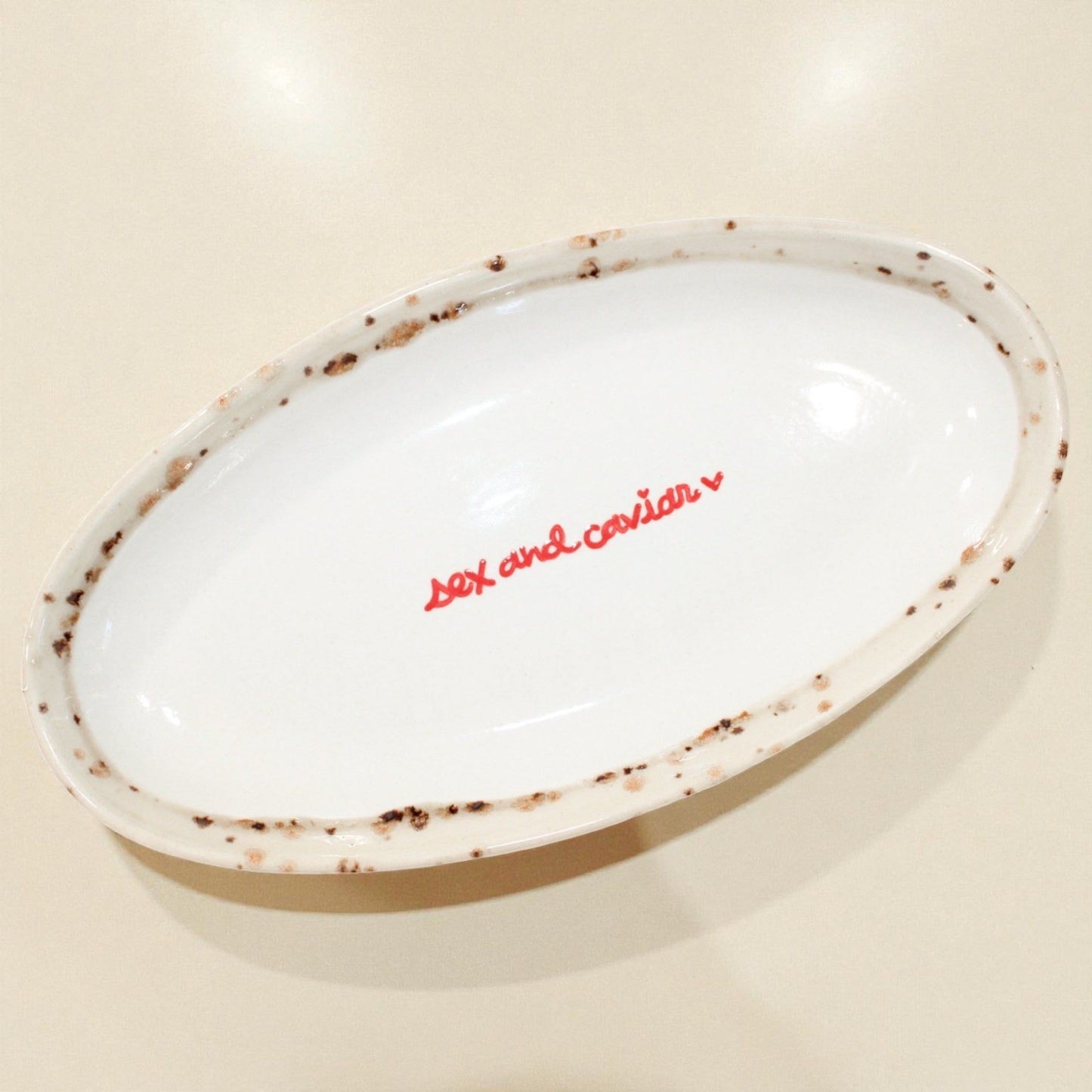 Hand-painted “sex and caviar” Dish