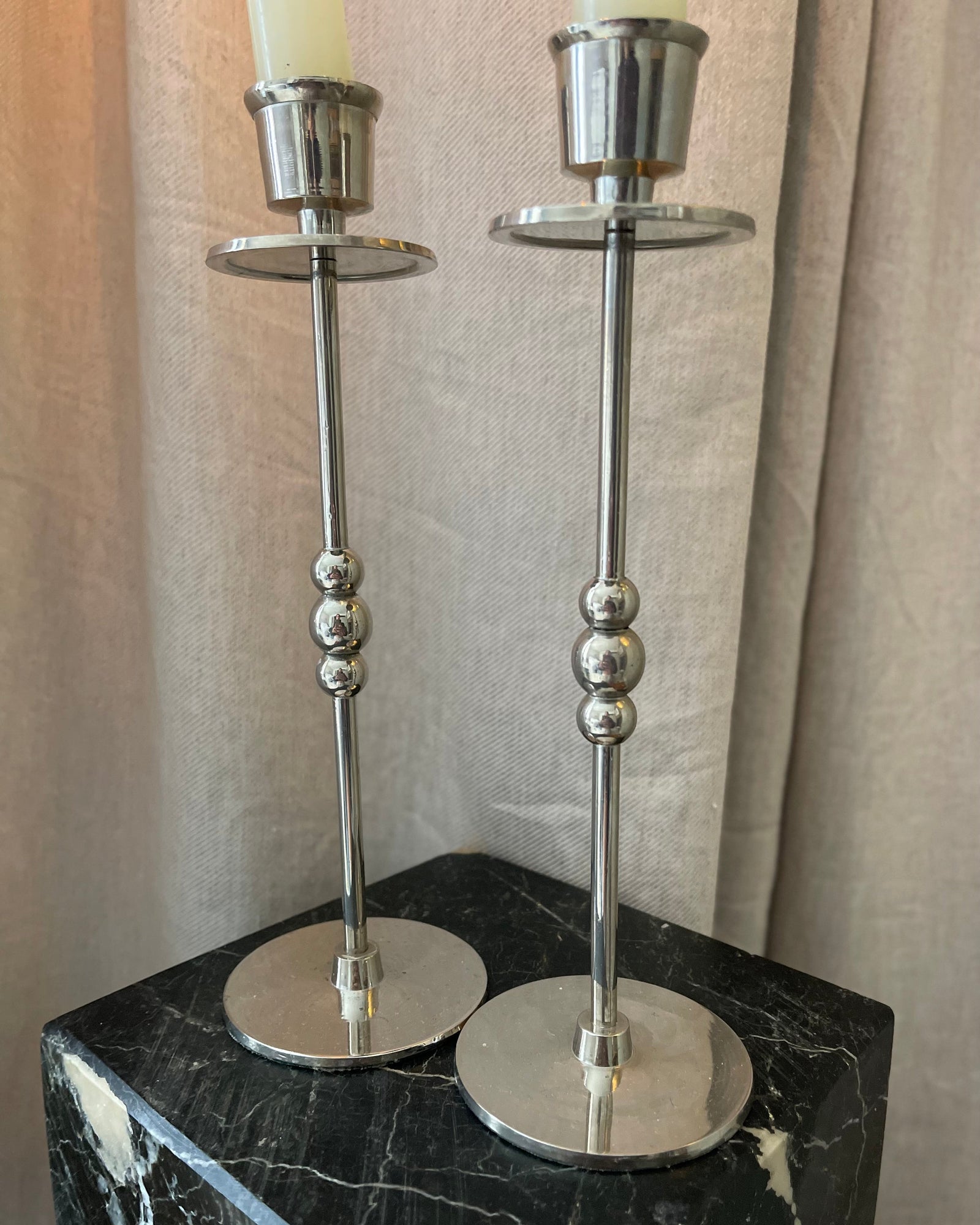 A Pair of Chrome Plated Candlesticks with Beads
