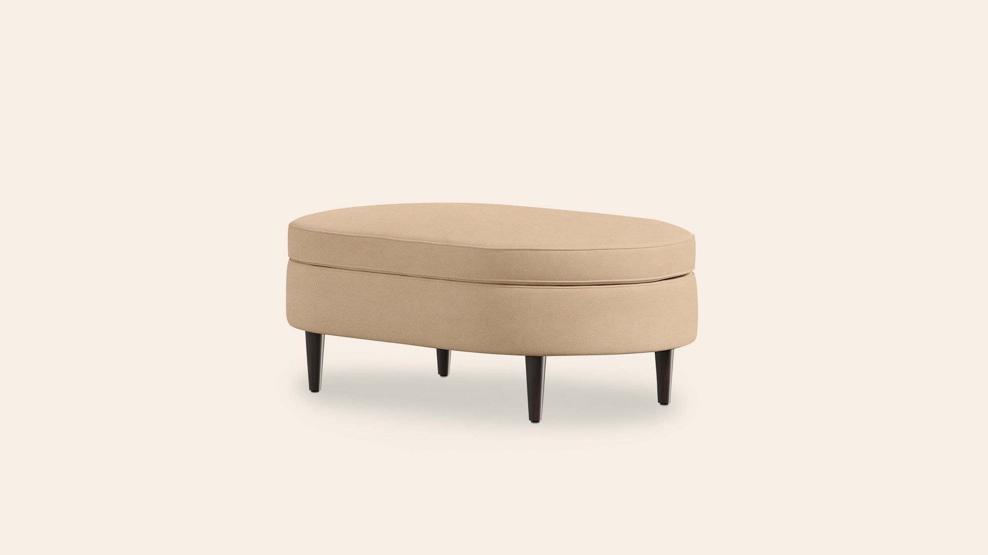 Beige ottoman with slight shadow on pale background