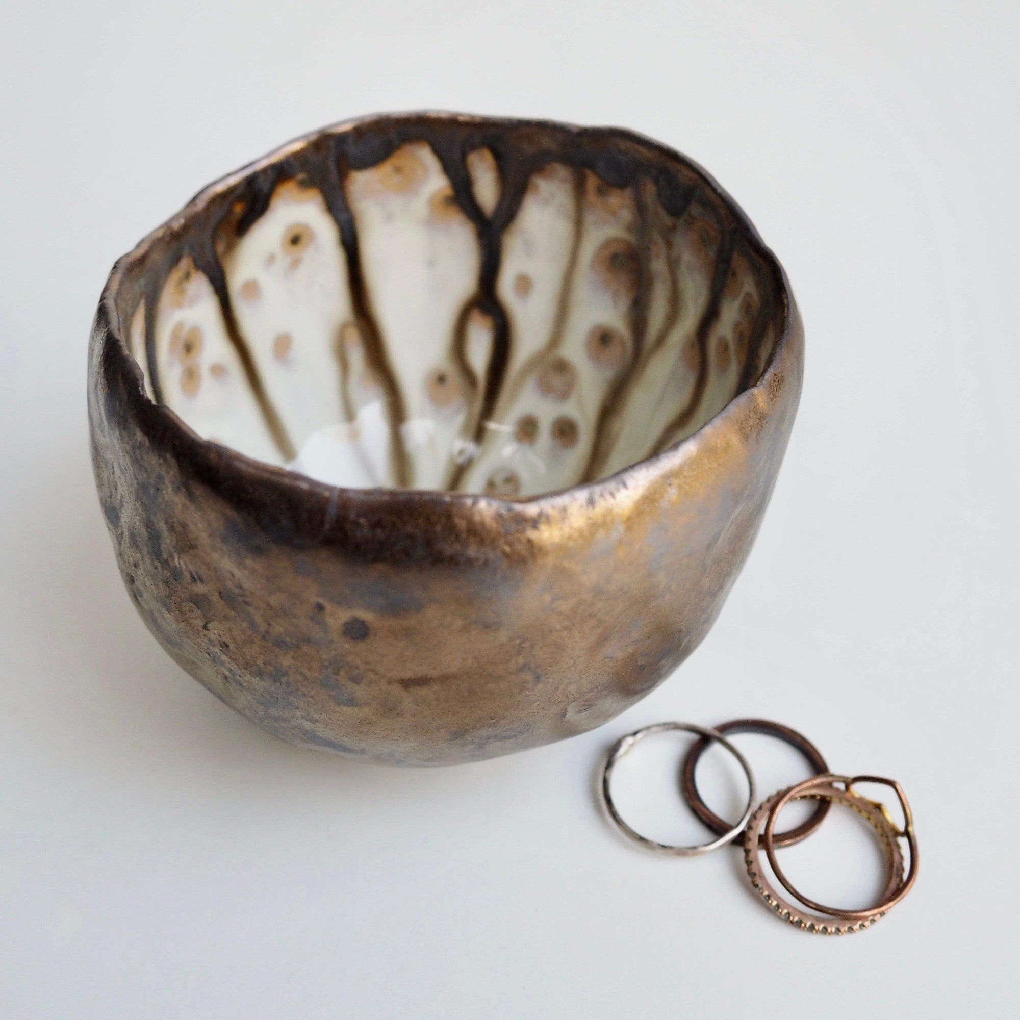 Handmade Gold Ceramic Ring Bowl with Swirly Dripped Glaze