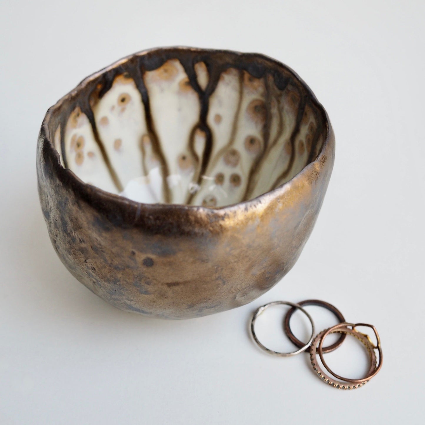 Handmade Gold Ceramic Ring Bowl with Swirly Dripped Glaze