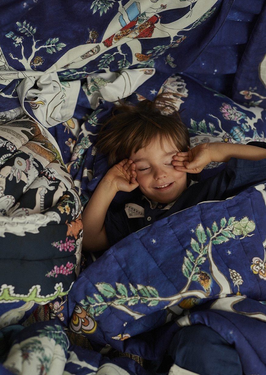 The Space Above the Ground Quilted Blanket