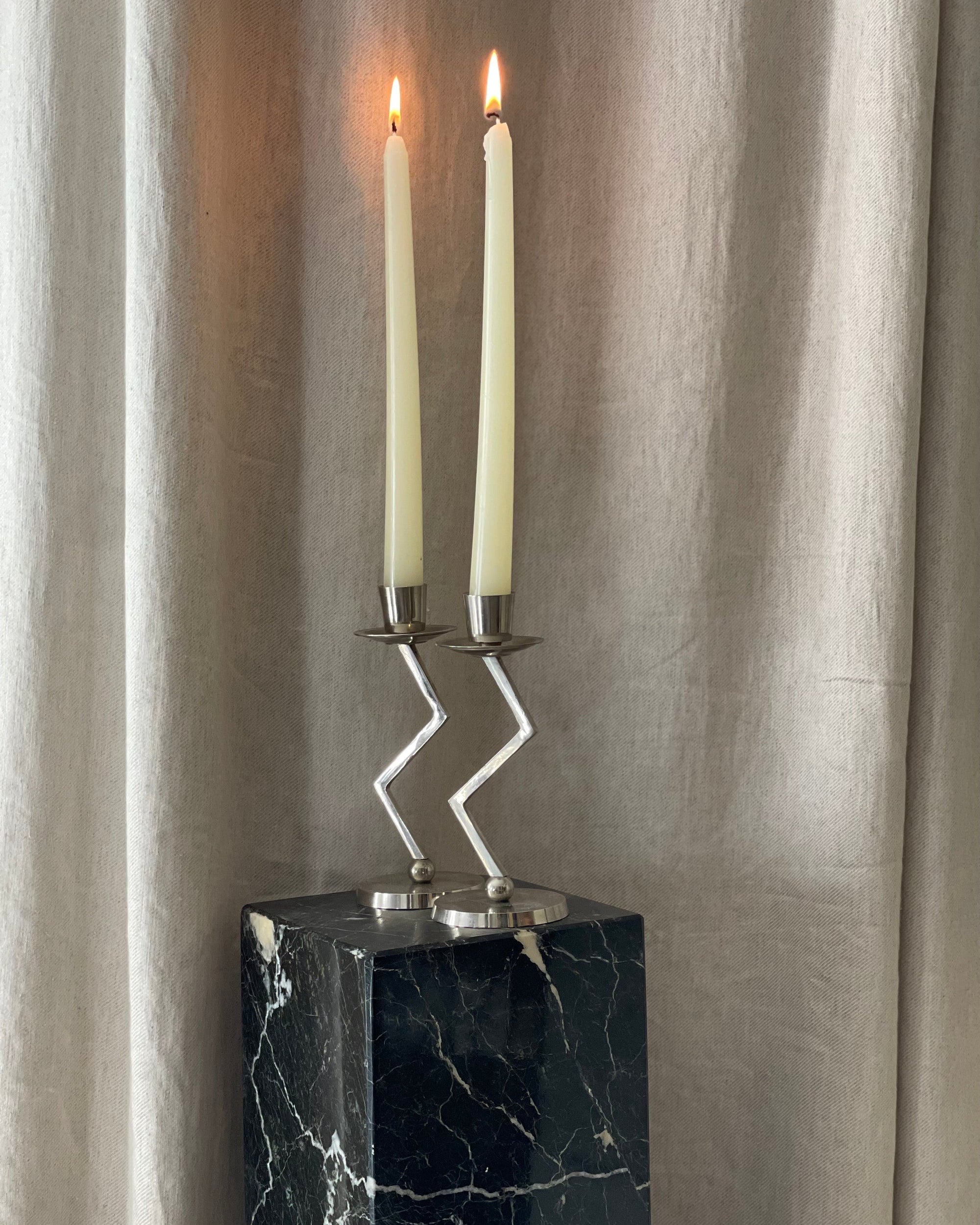 A Pair of Chrome Memphis Zig Zag Candlesticks