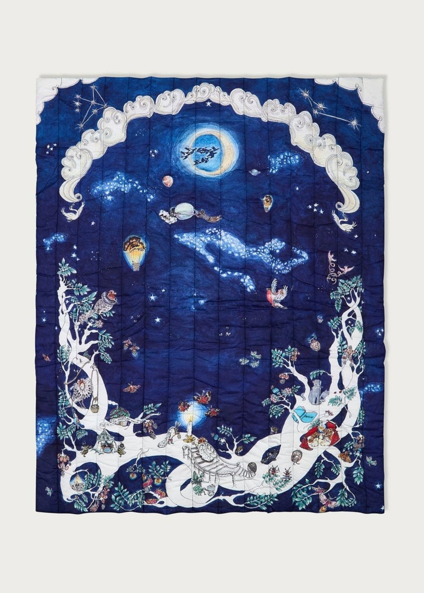 The Space Above the Ground Quilted Blanket