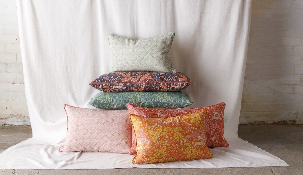 Staffordshire Bolster Cushion in Rust and Stafford Pink