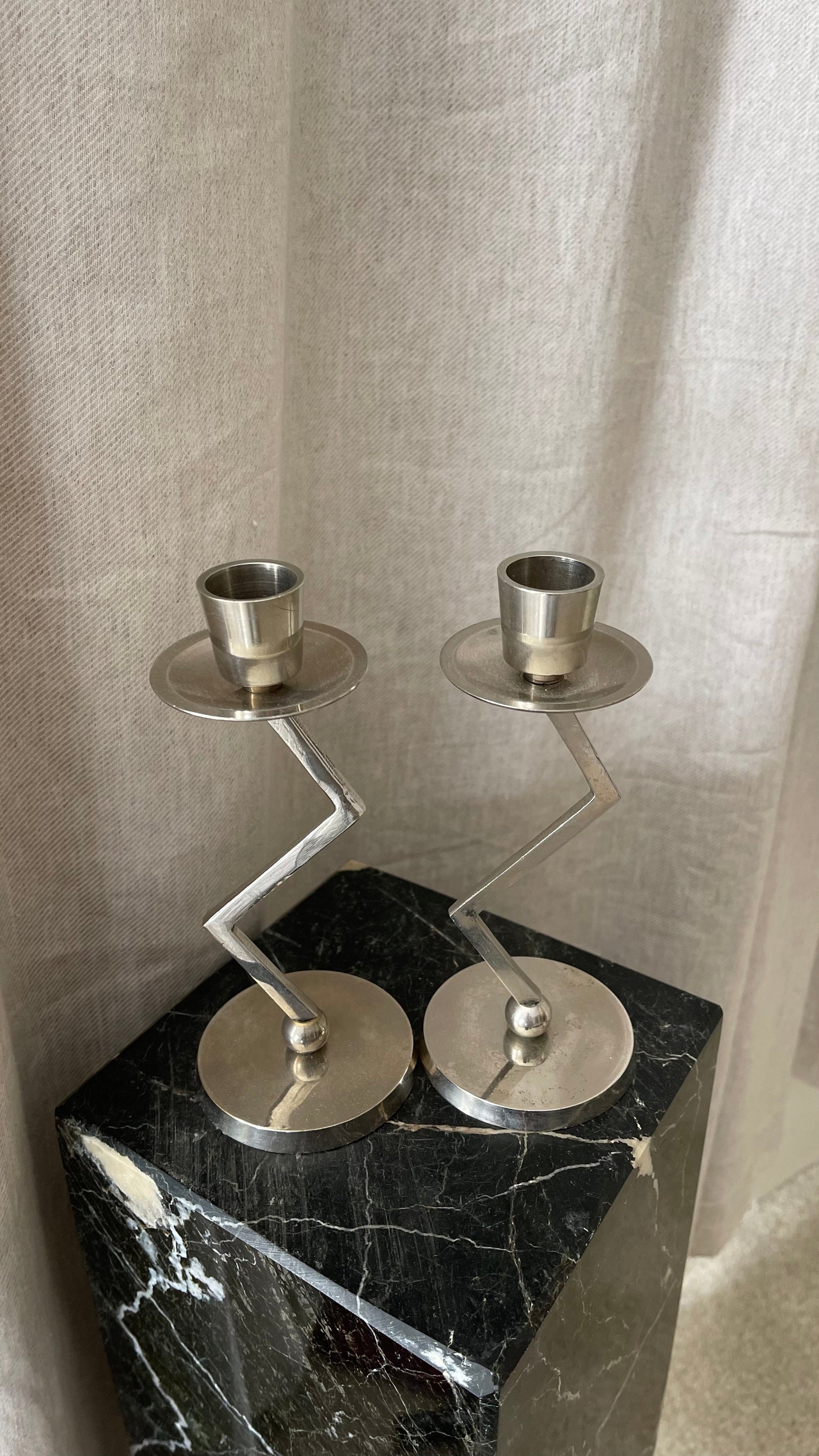 A Pair of Chrome Memphis Zig Zag Candlesticks